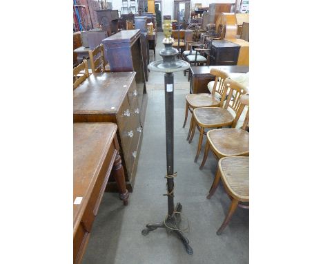 A cast metal standard lamp