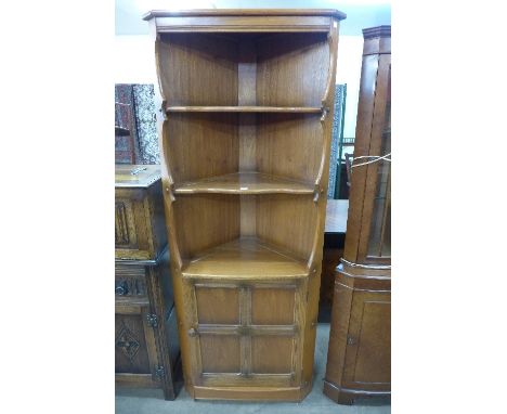 An Ercol freestanding corner cabinet