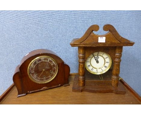 An oak wall clock and walnut mantel clock