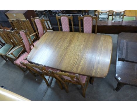 An Ercol extending dining table and six chairs