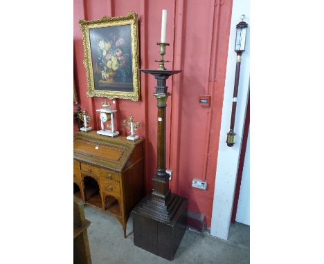 An oak and brass church alter lamp