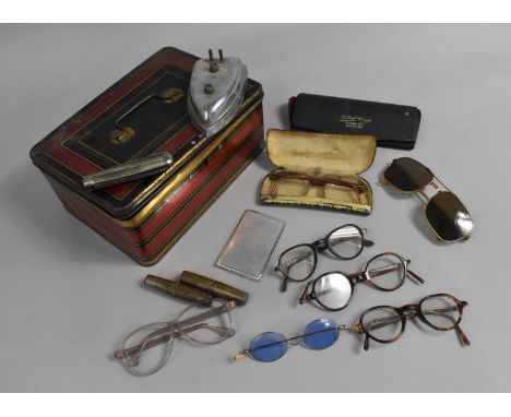 A Vintage Tin Containing Spectacles, Sunglasses, Penknife, Travelling Corkscrew etc 