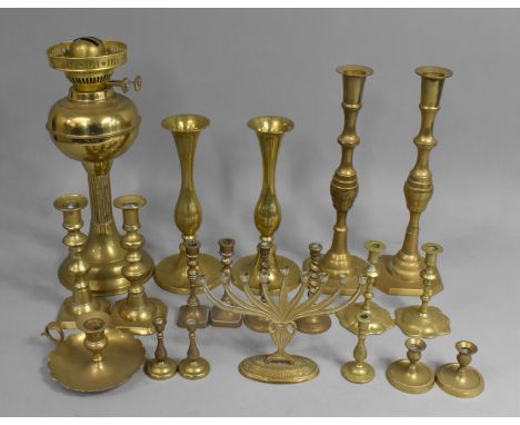 A Collection of Various Brass Candlesticks, Menorah, together with an Oil Lamp Base of Reeded Column Form 