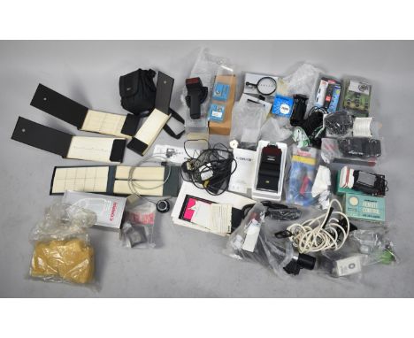 A Collection of Various Vintage Photographic Equipment to Include Flash Guns and Units, Various Cables, Light Meters, Shutter