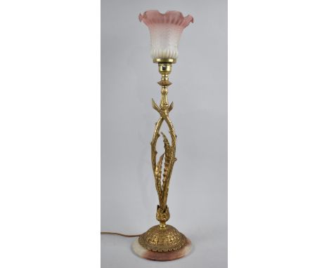 An Impressive Gilt Metal and Onyx Based Table Lamp, Having Foliate Support and Opaque Pink and Plain Glass Shade, 56cms High 