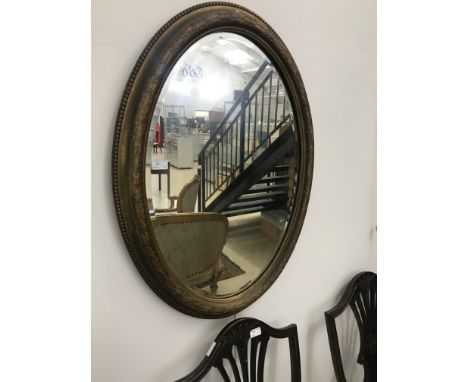 A gilt-framed mirror