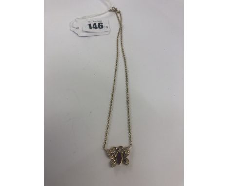 A 9ct gold ruby &amp; diamond butterfly pendant on chain