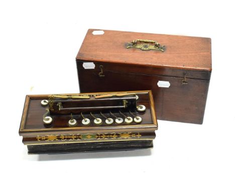 Flutina 16 treble levers, two bass levers, two drones operated by rocker switches on treble side, bellows labelled 'W Winrow 