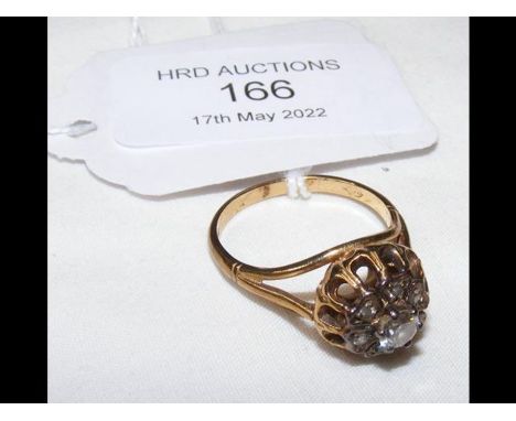 A 9ct gold ring with diamond cluster setting