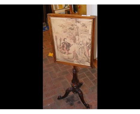 A 19th century pole screen with tapestry panel, on tripod base