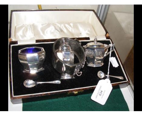 A silver condiment set in presentation case together with a silver bangle
