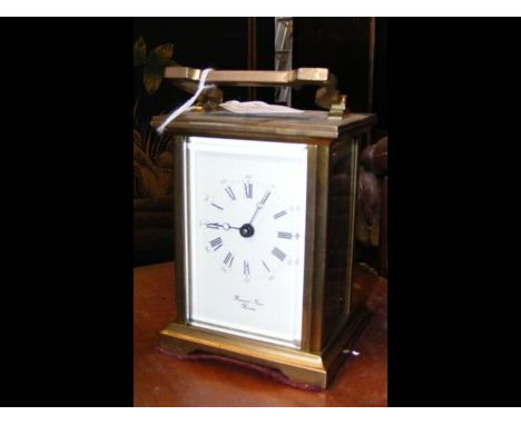 A brass cased carriage clock - 13cms high