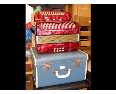 A Hohner Amatona III accordion in case  