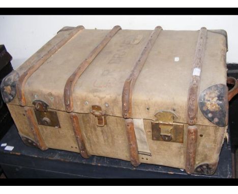 A vintage wooden bound cabin trunk 
