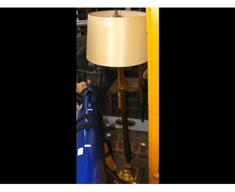 A metal standard lamp with square base and cream shade 