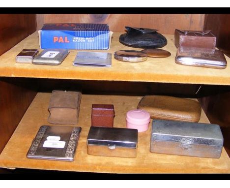 A medley of travelling accessories, including cased men's razors, cigarette cases and Yardley compact mirror - on two shelves