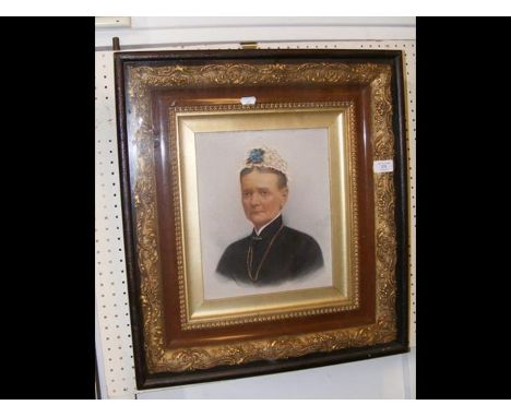 A portrait of a Victorian lady in decorative frame 