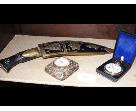 A silver mounted travelling clock, pocket watch and KukuriCONDITION REPORTpocket watch - no hallmarks - winds and runs but is