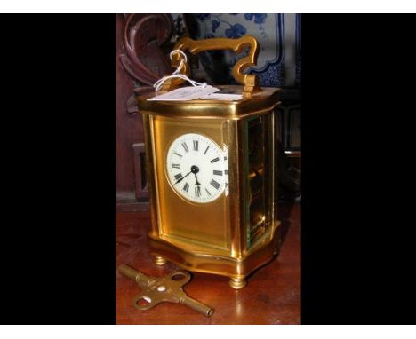 A brass cased carriage clock - 14cms high