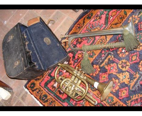 An old Boosey &amp; Co cornet in carrying case together with a bugle