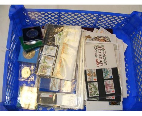 A collection of First Day covers and commemorative coins