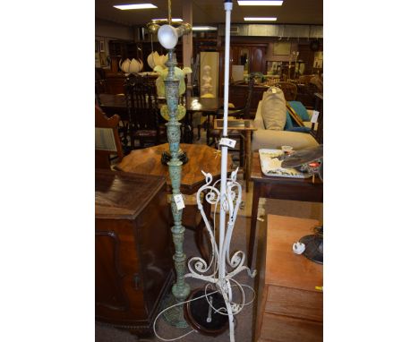 A patinated brass standard lamp with bird decoration; and a Victorian white painted adjustable standard lamp (converted to el
