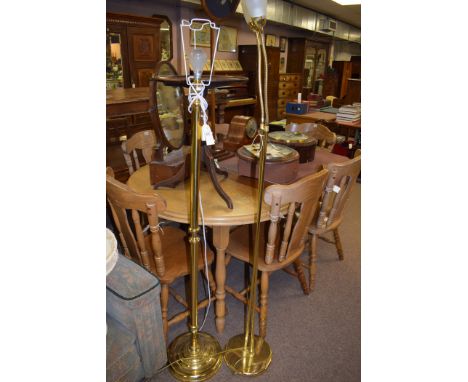 A modern brass standard lamp; and a modern brass uplighter.  (2)