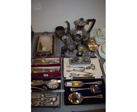 Plated metalware, to include: tea ware; trophy cups; a tureen and cover; sugar tongs; caddy spoon; cutlery; and other items.