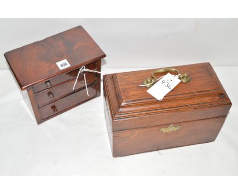 A Georgian mahogany tea caddy, the cover opening to reveal fitted compartments; and a 19th Century mahogany miniature chest o