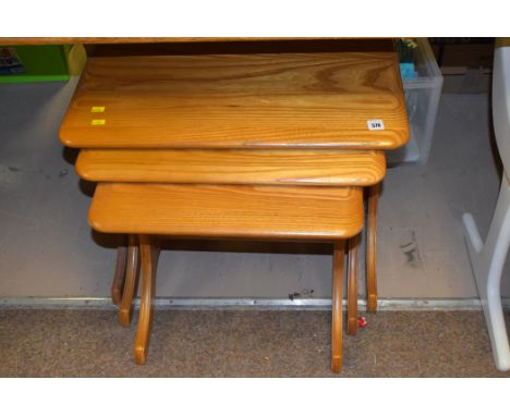 A Jentique light stained  oak nest of three tables.