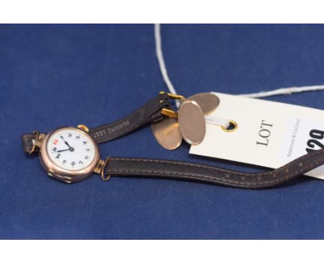 A 9ct. yellow gold cased lady's wristwatch, white enamel arabic dial with leather strap; together with a pair of 9ct. yellow 