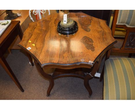 A Victorian inlaid rosewood shaped occasional table, the down swept legs joined by undertier terminating in ceramic castors, 