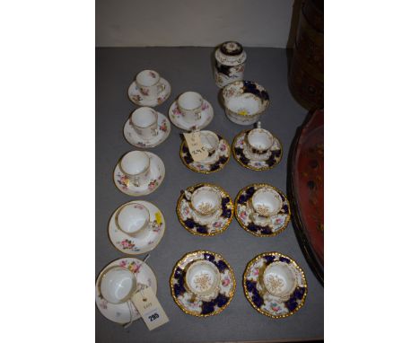 Six Copeland miniature tea cups and saucers, with matching bowl and tea caddy; together with six Royal Crown Derby miniature 