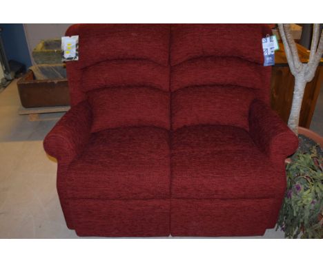 An HSL two-seater sofa upholstered in red material.