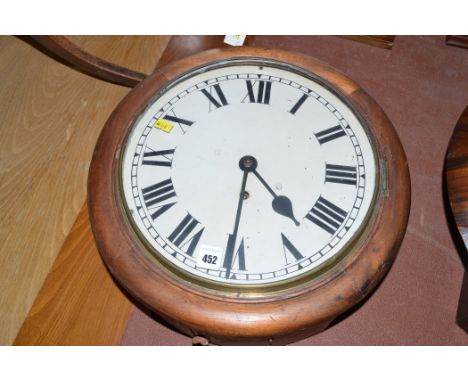 An early 20th Century circular wall clock, enamel roman dial, in mahogany case.