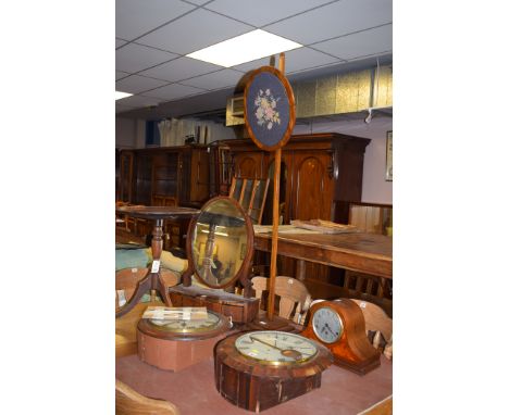 A mahogany pole screen, with circular tapestry screen decorated flowers; together with a Georgian inlaid mahogany toilet mirr