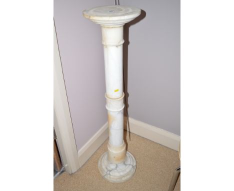 A white alabaster pedestal, 104cms high.