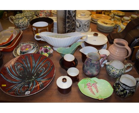 A large Poole ware charger, no. 5; a Carlton ware dish; Crown Devon shaped vase; a West Germany table lamp; and other items.