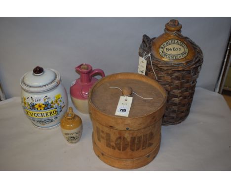 A stoneware jar within carafe type wicker basket, by W.B. Reid & Co. Ltd., Newcastle upon Tyne, B4677; together with a wooden