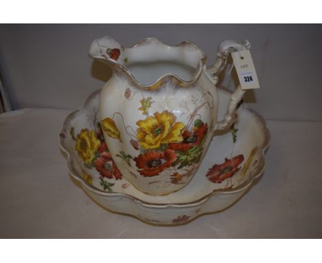 An S.H. & Sons 'Hatfield' pattern wash jug and basin with poppy decoration and gilt borders.