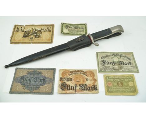 A KAR98 BAYONET with scabbard and a quantity of German bank notes 
