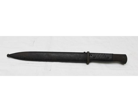 A GERMAN WORLD WAR II COMBAT BAYONET WITH SCABBARD 1329F on right ricasso, left ricasso E. Pack & S. 41CIC on scabbard, blade