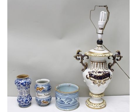 A COLLECTION OF FOUR CERAMIC ITEMS, being Majolica "Arbourella" wet drug jars, tin glazed, one painted with animals and the l