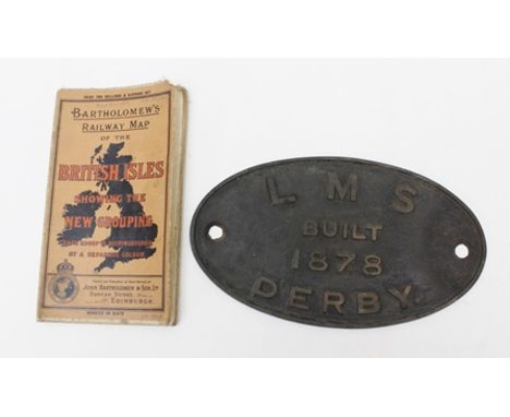 A CAST IRON OVAL RAILWAY ENGINE PLAQUE "LMS BUILT 1878 DERBY" 15.5cm high x 27cm wide, together with a BARTHOLOMEW'S RAILWAY 