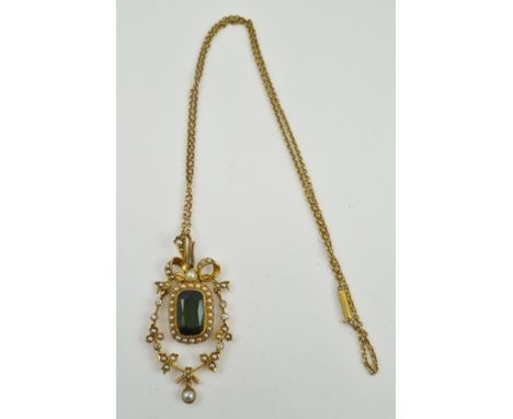 A DECORATIVE VICTORIAN DESIGN PENDANT, the yellow metal hinged form frame set with diamonds and seed pearls about a central f