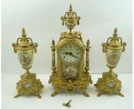 A CLOCK GARNITURE SET in the French Empire style, cast brass, with porcelain panel decoration, comprising mantel clock and a 