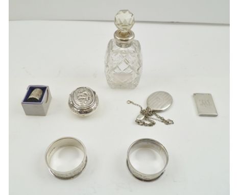 A COLLECTION OF SILVER ITEMS comprising; an embossed silver snuff box, the cover with dancing peasant decoration 5cm, togethe