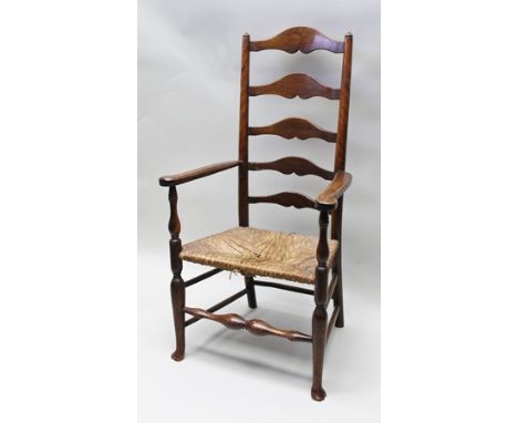 A 19TH CENTURY OAK LADDER BACK OPEN ARM CHAIR with woven seagrass seat, on turned pad foot fore supports and turned central s