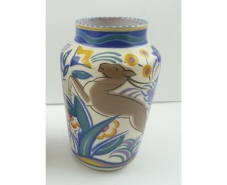 A "POOLE POTTERY" VASE, hand painted with leaping deer, amidst polychrome flowers, impressed and painted marks to base, green