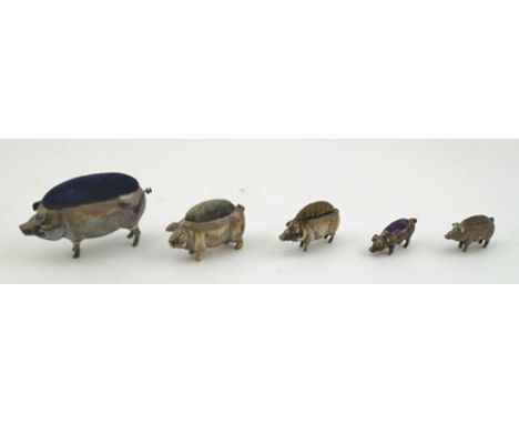 ADIE AND LOVEKIN LTD. AN EDWARDIAN SILVER PIG FORM PIN CUSHION, Birmingham 1905 including curly tail, 8cm long, together with